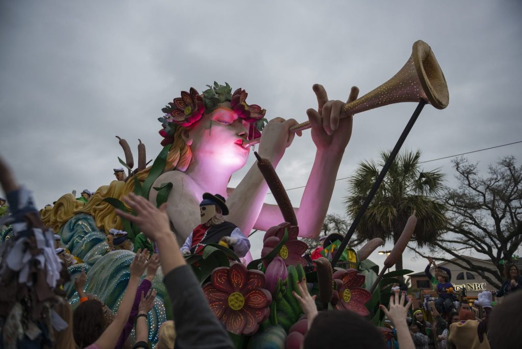 New Orleans, Louisiana, USA - February 9, 2013: An ornately decorated float belonging to the Krewe of Endymion passes through a crowd on Canal Street during Mardi Gras.
