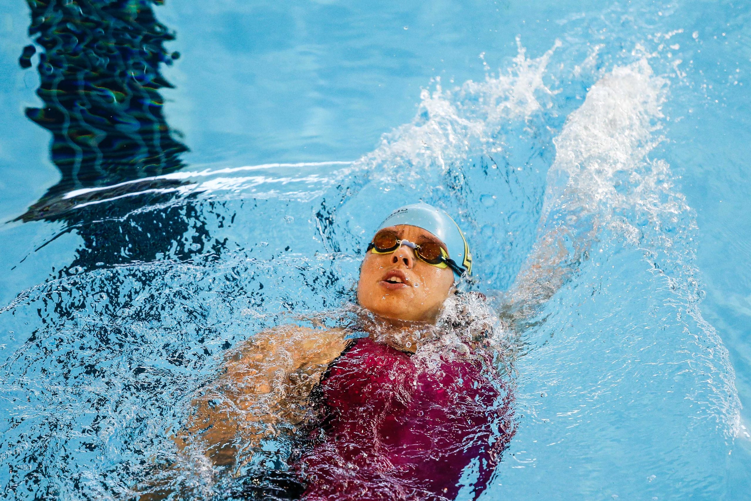 Edenia Garcia backstroke swimming in pool