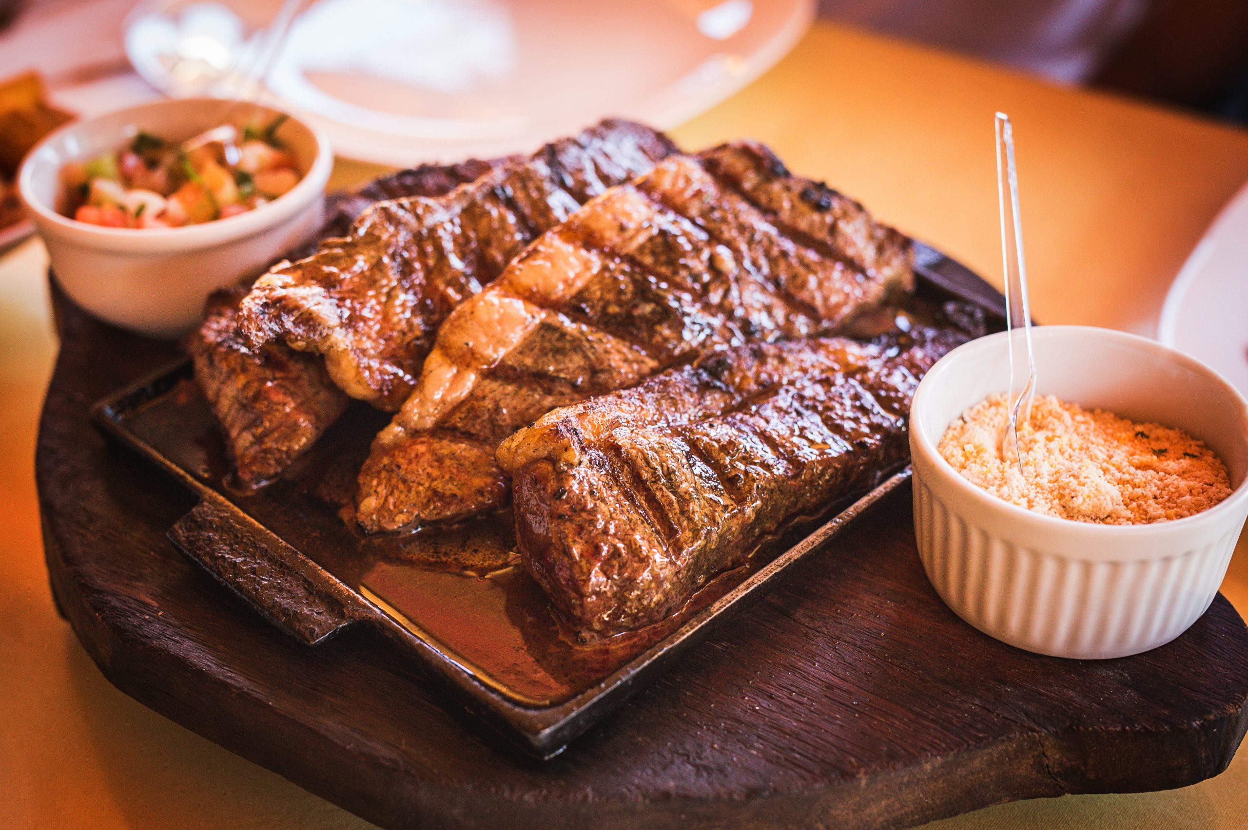 Grilled Picanha, traditional Brazilian beef cut. Meat served on the plate, luxury dinner.